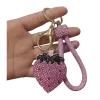 The pink strawberry-shaped keychain is a cute and girlish pendant that is small and portable Item Picture